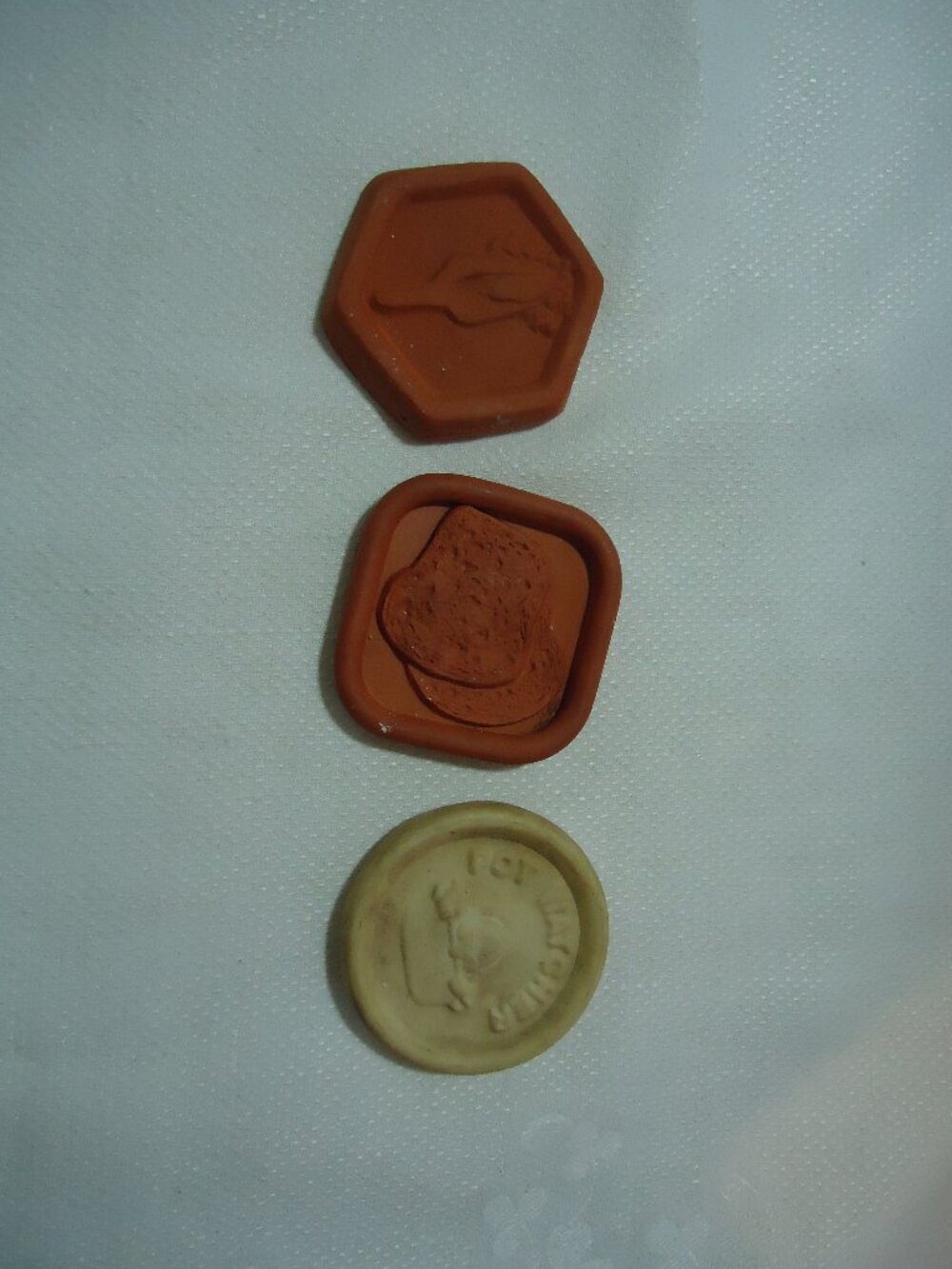 3 clay kitchen discs- two bread/sugar savers and one vintage "Pot Watcher"
